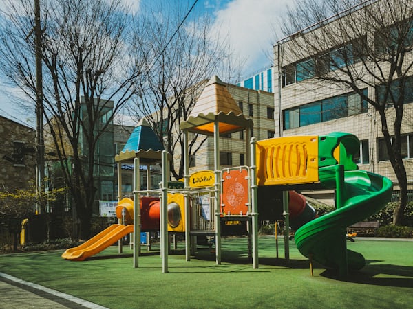 Outdoor playground with bright play equipment